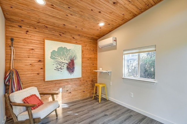 sitting room featuring wooden ceiling, vaulted ceiling, a wall mounted AC, and hardwood / wood-style flooring