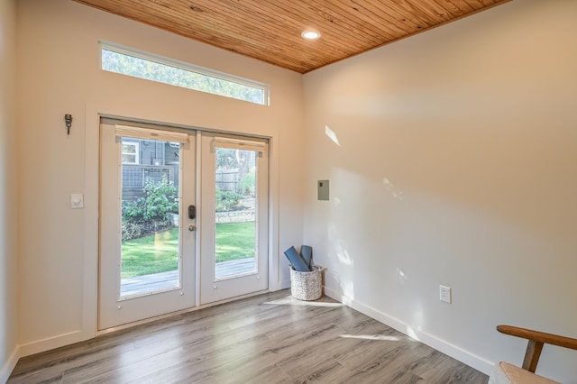 doorway featuring wooden ceiling, light hardwood / wood-style floors, and french doors