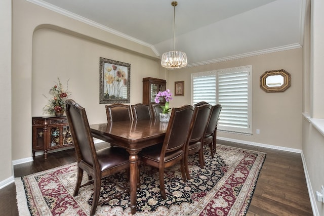 dining room with crown molding, dark hardwood / wood-style flooring, and a notable chandelier