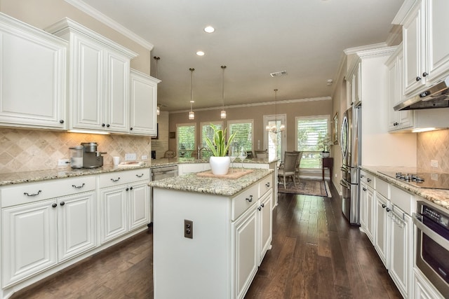 kitchen with stainless steel appliances, dark hardwood / wood-style floors, white cabinetry, and a center island