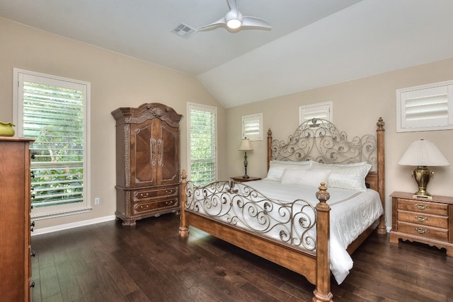 bedroom with ceiling fan, lofted ceiling, and dark hardwood / wood-style floors