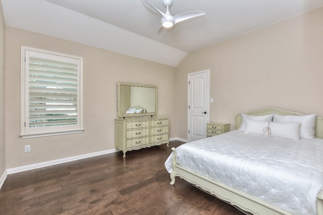 bedroom featuring vaulted ceiling, dark hardwood / wood-style flooring, and ceiling fan