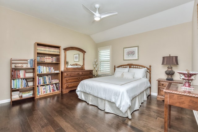 bedroom with vaulted ceiling, ceiling fan, and dark hardwood / wood-style floors