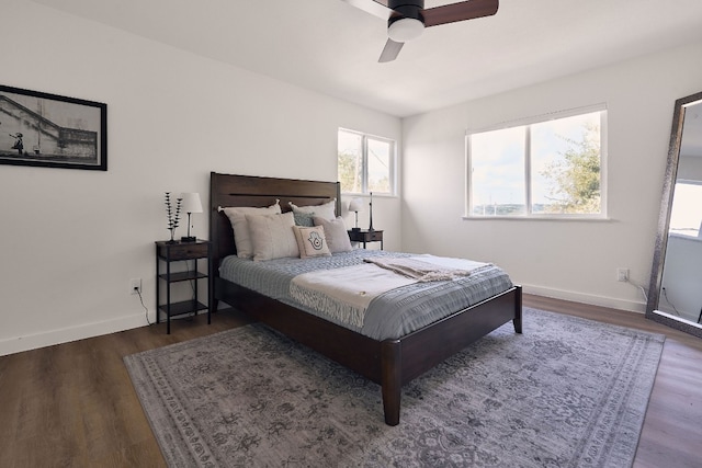 bedroom with ceiling fan and dark wood-type flooring