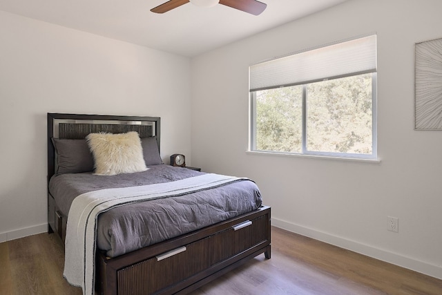 bedroom featuring wood-type flooring and ceiling fan