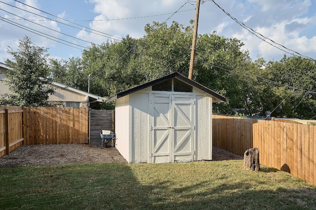 view of outbuilding with a lawn