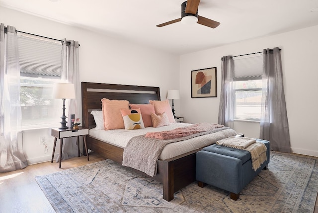 bedroom with light hardwood / wood-style flooring and ceiling fan