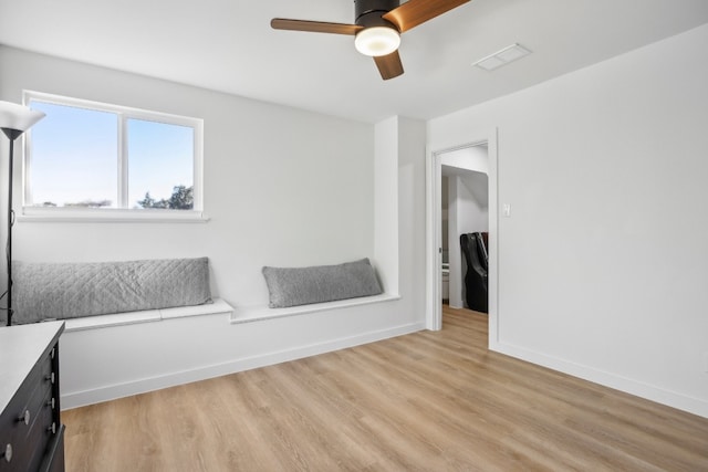 interior space with ceiling fan and light wood-type flooring