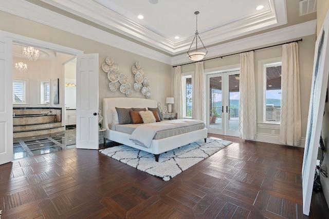 bedroom featuring crown molding, a tray ceiling, dark parquet floors, access to outside, and french doors