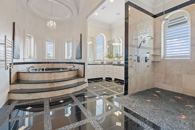 bathroom featuring ornamental molding, tiled shower, vanity, and an inviting chandelier