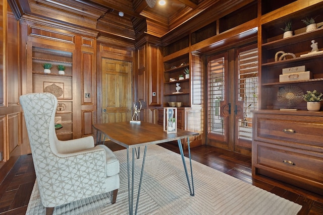 office area featuring built in features, coffered ceiling, ornamental molding, beamed ceiling, and wood walls