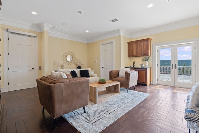 living room featuring crown molding, dark parquet flooring, and french doors