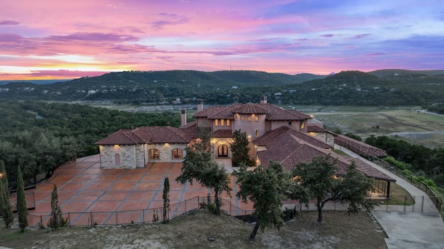 aerial view at dusk with a mountain view