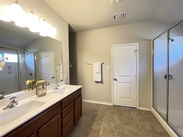 bathroom featuring vanity and an enclosed shower