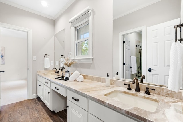 bathroom with an enclosed shower, crown molding, vanity, and hardwood / wood-style flooring