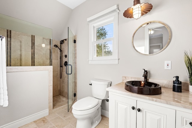 bathroom featuring lofted ceiling, walk in shower, ceiling fan, vanity, and toilet