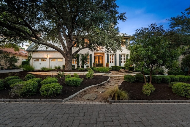 view of front of property with french doors and a garage