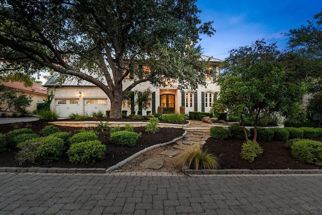 3605 Douglas Dr, Horseshoe Bay, TX 78657 - view of front facade with stucco siding and a garage
