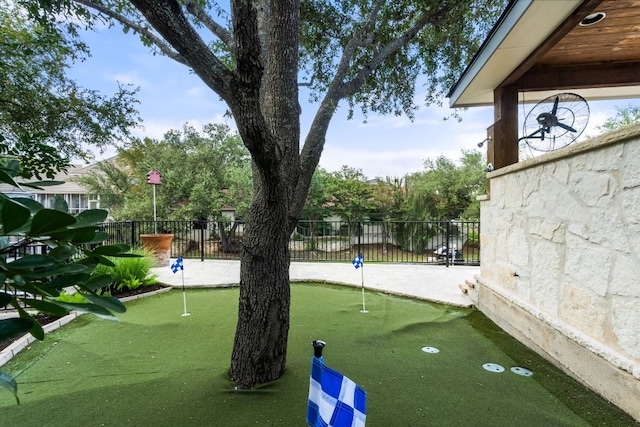 3605 Douglas Dr, Horseshoe Bay, TX 78657 - view of home's community with a putting green and fence
