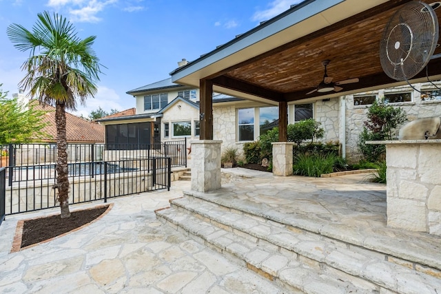 view of patio featuring ceiling fan