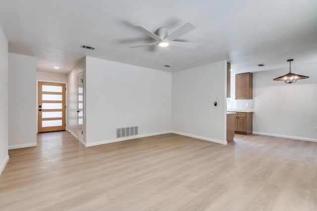 unfurnished living room with light hardwood / wood-style floors and ceiling fan