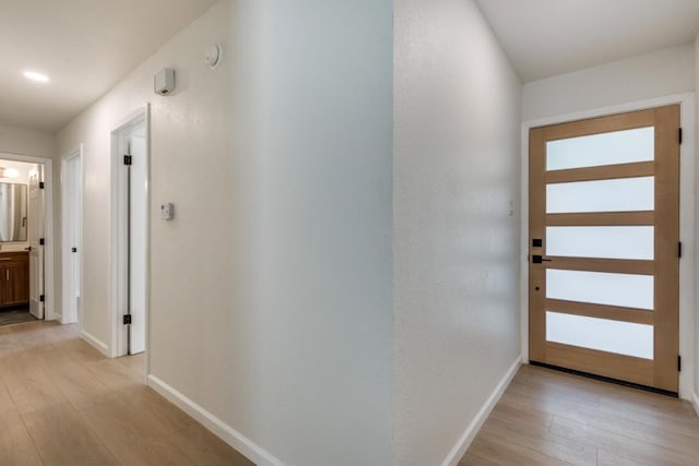 corridor featuring light hardwood / wood-style flooring