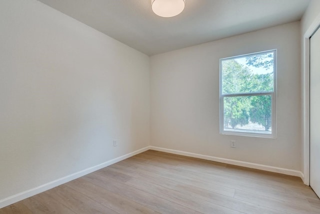 empty room with light hardwood / wood-style floors