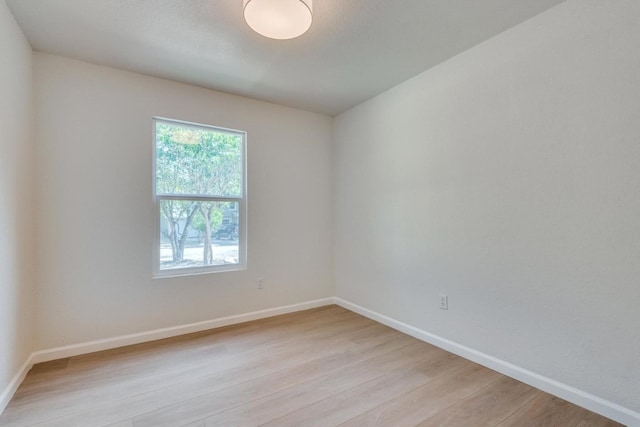 unfurnished room featuring light hardwood / wood-style flooring