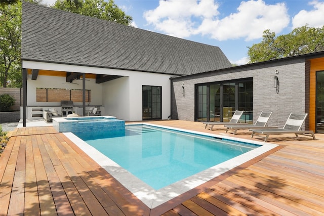 view of pool with an in ground hot tub, area for grilling, ceiling fan, and a wooden deck