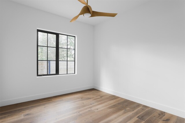 unfurnished room featuring ceiling fan and light wood-type flooring