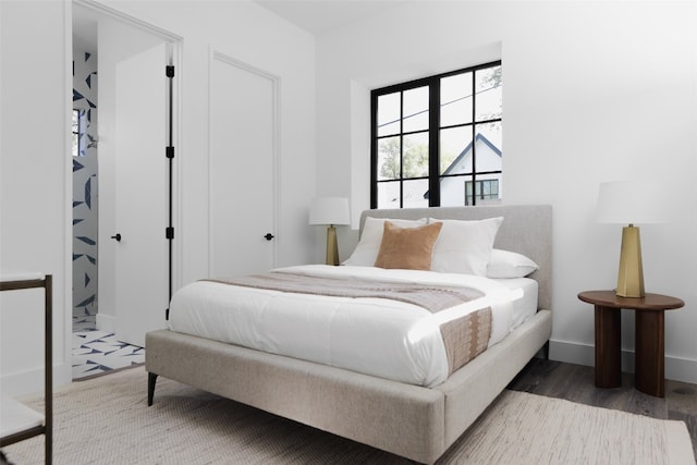 bedroom featuring dark hardwood / wood-style floors