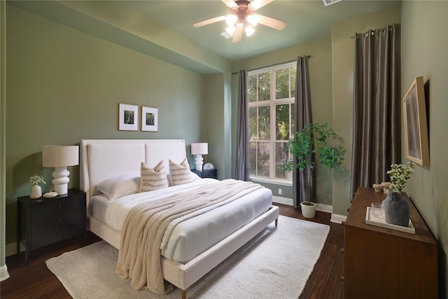 bedroom featuring ceiling fan and dark wood-type flooring