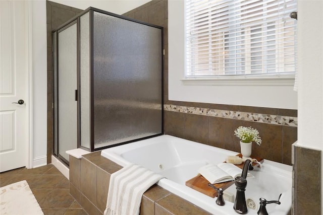 bathroom featuring tile patterned flooring and shower with separate bathtub