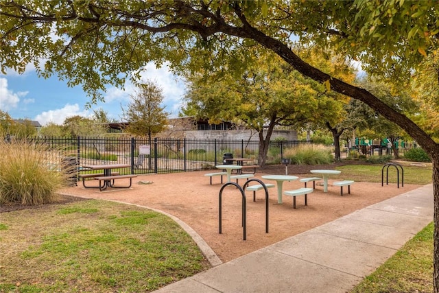 view of property's community featuring a playground and a yard