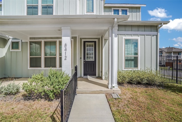 property entrance featuring covered porch