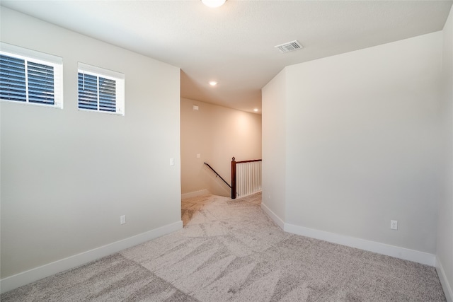 empty room featuring light carpet