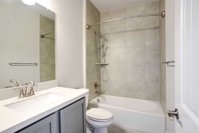 full bathroom featuring vanity, toilet, and tiled shower / bath