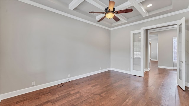 empty room featuring crown molding, french doors, dark wood-type flooring, and coffered ceiling