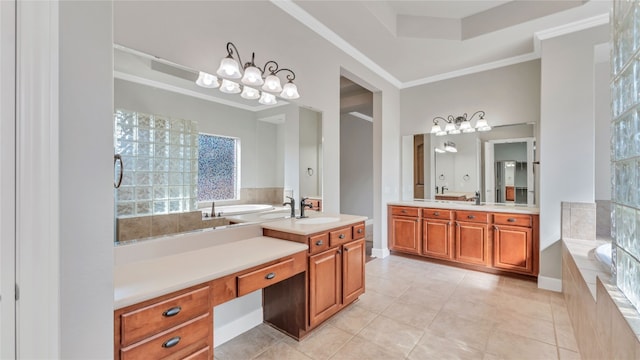 bathroom featuring tile patterned floors, tiled bath, crown molding, and vanity