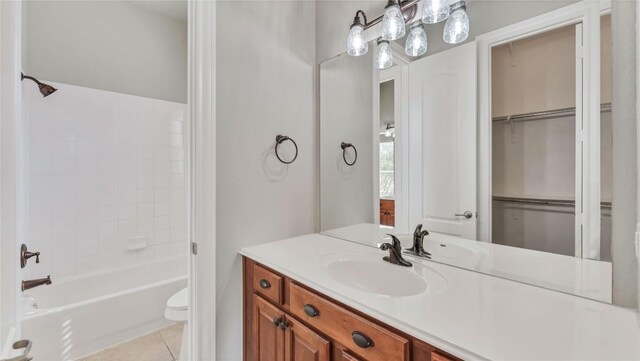 full bathroom with tile patterned flooring, vanity, shower / bathtub combination, and toilet