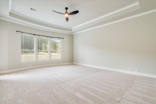 175 Blazing Star Dr, Austin, TX 78737 - carpeted empty room featuring a raised ceiling, crown molding, and a ceiling fan
