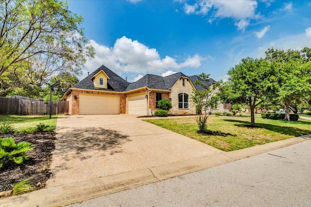 175 Blazing Star Dr, Austin, TX 78737 - view of front of house with brick siding, an attached garage, concrete driveway, and a shingled roof