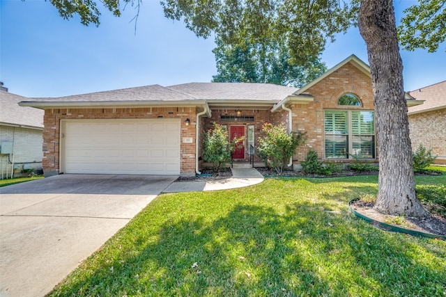 ranch-style home with a front yard and a garage