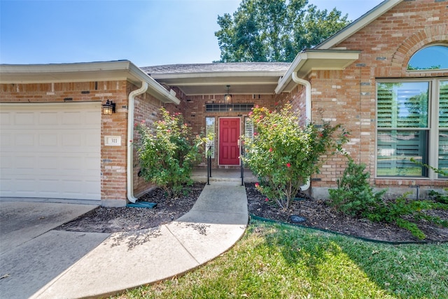 view of exterior entry featuring a garage