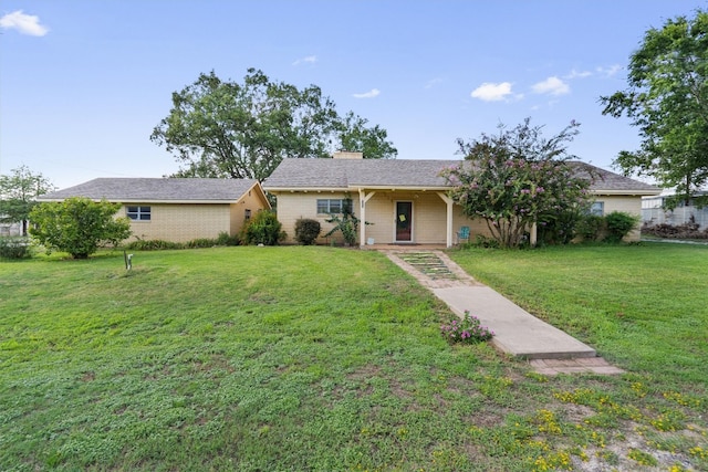 single story home featuring a front yard