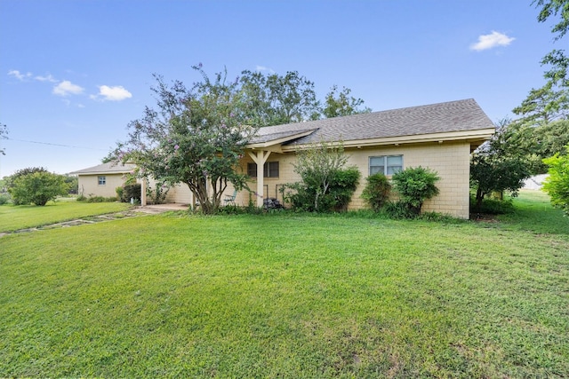 ranch-style house with a front yard