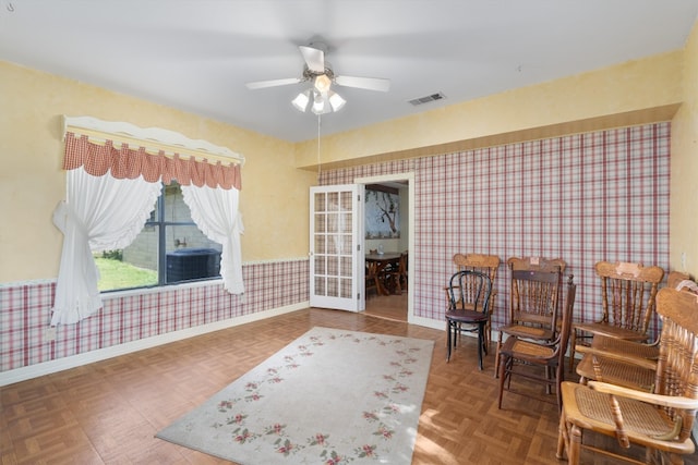 interior space featuring ceiling fan