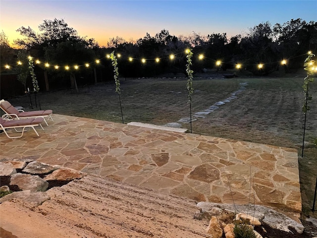 view of patio terrace at dusk