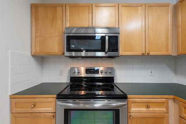 kitchen with decorative backsplash, light brown cabinetry, and stainless steel appliances