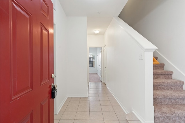 foyer entrance featuring light tile patterned floors